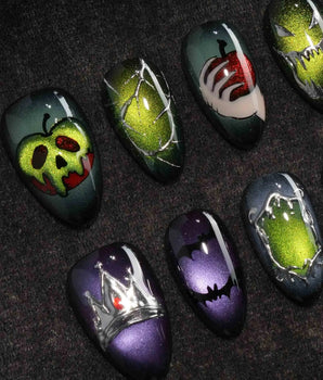 Poison Apple press on nails with a green skull poison apple, fanged grin, bat and 3D silver crown on green and purple cat eye - image 1