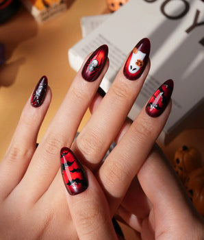 Blood Moon press on nails with black bats, bare trees, a ghost holding a pumpkin and a silver glitter spider on deep red cat eye - image 2