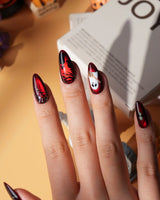 Blood Moon press on nails with black bats, bare trees, a ghost holding a pumpkin and a silver glitter spider on deep red cat eye - image 5