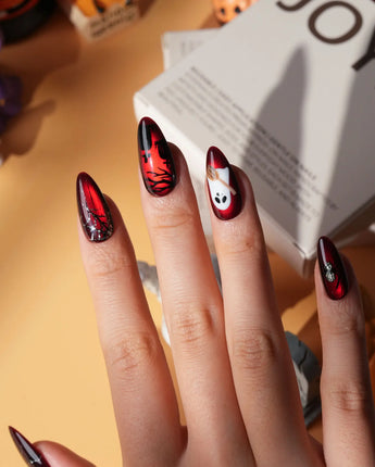 Blood Moon press on nails with black bats, bare trees, a ghost holding a pumpkin and a silver glitter spider on deep red cat eye - image 5