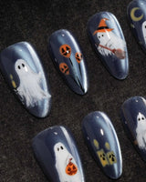 Ghost Errands press on nails with little white ghosts holding a pumpkin, a broom and an umbrella on slate blue cat eye - image 1