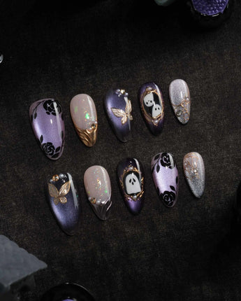 Black Rose Ball press on nails with black roses, a gold butterfly, pearls and a ghost in a gold frame on lilac violet pearl cat eye - image 3