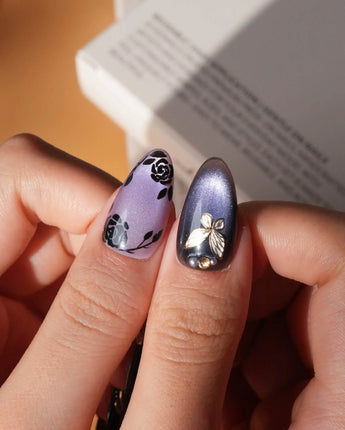 Black Rose Ball press on nails with black roses, a gold butterfly, pearls and a ghost in a gold frame on lilac violet pearl cat eye - image 4