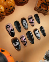 Cat Sitter press on nails with a long-tailed black cat, a row of bats and a white ghost holding a kitten on black and nude with pink shimmer - image 2