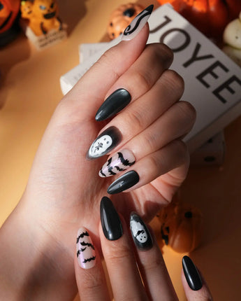 Cat Sitter press on nails with a long-tailed black cat, a row of bats and a white ghost holding a kitten on black and nude with pink shimmer - image 3