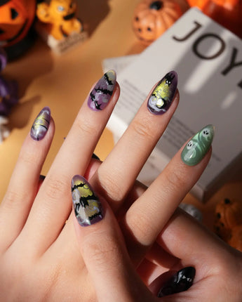 Fright Night press on nails with a fanged black cat, bats, white skulls and spider webs on purple gold and green cat eye - image 2
