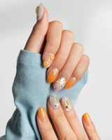 Iced Punch glossy cocktail-inspired nails with pear, citrus, and chrome utensil accents