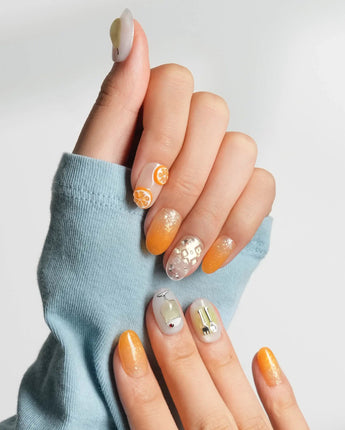 Iced Punch glossy cocktail-inspired nails with pear, citrus, and chrome utensil accents