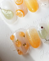 Iced Punch amber jelly press-on nails with 3D pear slices and orange wheels