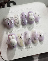 Icy Miffy-Purple press-on nails in extra short almond shape — Dreamy Purple, 3D Bunny & Silver Wire Bows.