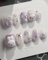 Icy Miffy-Purple press-on nails in extra short oval shape — Dreamy Purple, 3D Bunny & Silver Wire Bows.