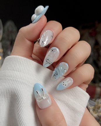 Icy Miffy nail art close-up showing Fresh Sky Blue, 3D Bunny & Silver Bows. details