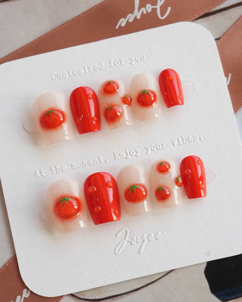 Icy Tomato glossy summer press-on nails with clear base and raised tomato details