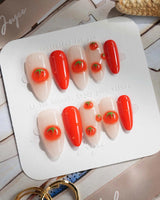Icy Tomato handmade 3D tomato nails with orange-red accents and clean clear base