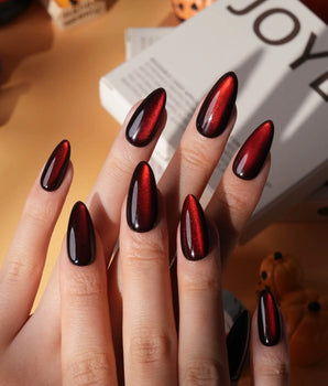 Inferno spotlight cat eye press on nails, near-black red with a long bright red magnetic glow - image 1