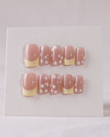 Petal Pop Spring Nails press-on nail set — yellow floral french tip nails design, hand-painted with real gel polish