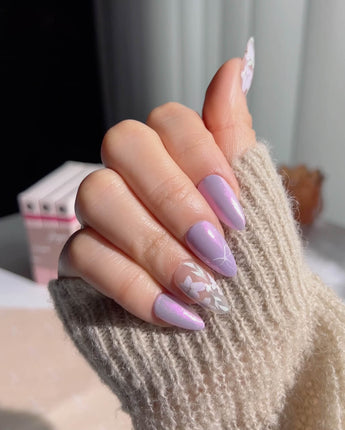 Flower Sea nail art close-up showing  Lavender chrome and Hand-painted White Florals details