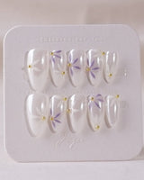 Garden Party press-on nail set — minimal floral french tip design, hand-painted with real gel polish
