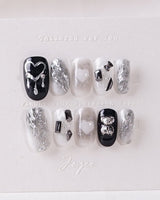 Dark Ice press-on nails in short oval shape — black gradient silver chrome 3D gothic nails