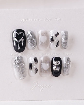 Dark Ice press-on nails in short oval shape — black gradient silver chrome 3D gothic nails