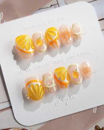 Juicy Juicy tropical citrus press-on nails with orange slice nail art