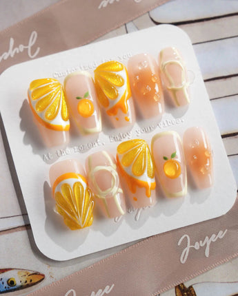Juicy Juicy close-up of translucent orange press-on nails with fruit texture