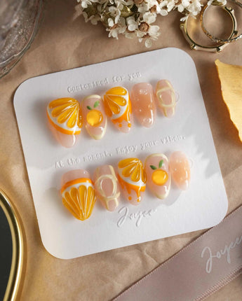 Juicy Juicy hand-painted orange soda inspired press-on nails with jelly shine