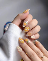 Juicy Juicy orange and white press-on nail set with sculpted citrus details
