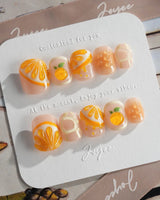 Juicy Juicy glossy handmade press-on nails with sunny orange jelly color