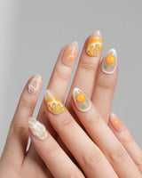 Juicy Juicy extra short almond press-on nails with translucent orange fruit art