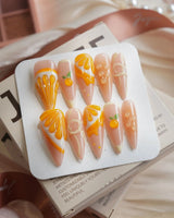 Juicy Juicy orange jelly press-on nails in long stiletto shape