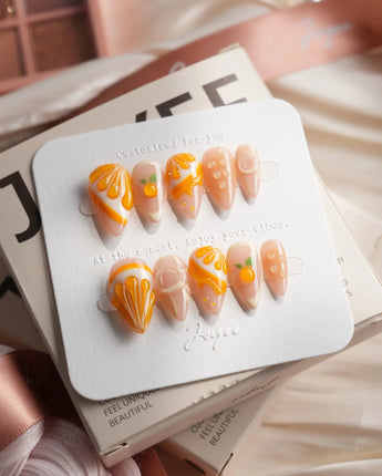 Juicy Juicy orange citrus press-on nails in short stiletto shape