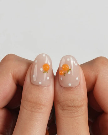 Juicy Summer handmade orange nail art on cool blue and warm nude bases