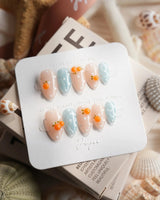 Juicy Summer orange citrus press-on nails in extra short almond shape