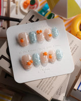 Juicy Summer orange citrus press-on nails in extra short oval shape