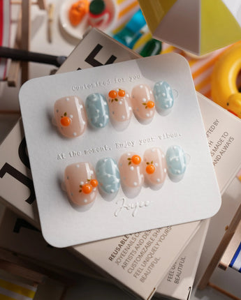 Juicy Summer orange citrus press-on nails in extra short oval shape