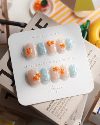 Juicy Summer orange citrus press-on nails in extra short squoval shape