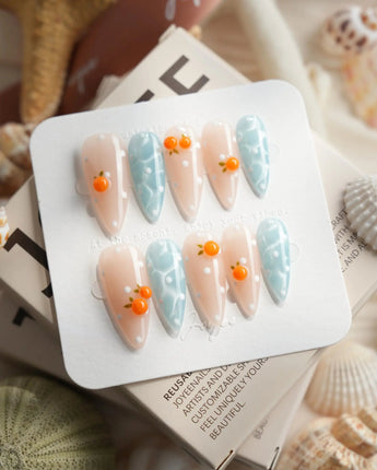 Juicy Summer orange citrus press-on nails in medium stiletto shape