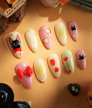 Kiki’s Enchanted Picnic handmade press-on nails featuring Pastel Multicolor, Hand-painted Cat & Bow.