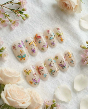 Kiln Spring press-on nails in short oval shape — Colorful Butterflies, Hand-painted Golden Outlines & Glitter Petals.