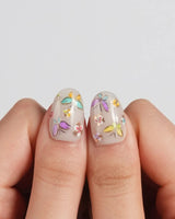 Kiln Spring press-on nails in short oval shape — Colorful Butterflies, Hand-painted Golden Outlines & Glitter Petals.