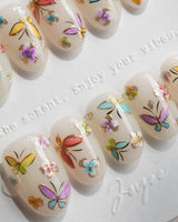Kiln Spring handmade press-on nails featuring Colorful Butterflies, Hand-painted Golden Outlines & Glitter Petals.