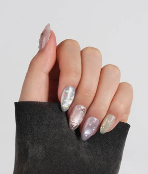 Koi Dream handmade press-on nails featuring Shimmering Mermaid Pearl, Metallic Relief Goldfish & cat eye effict.