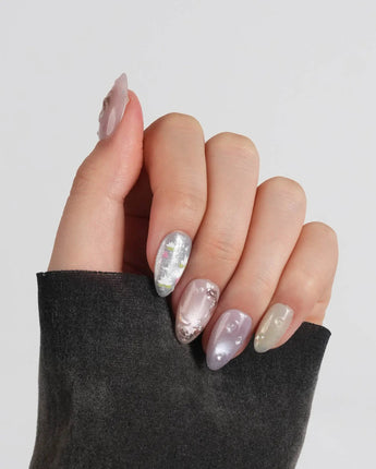 Koi Dream handmade press-on nails featuring Shimmering Mermaid Pearl, Metallic Relief Goldfish & cat eye effict.