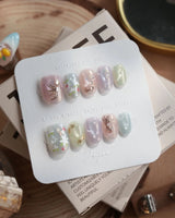 Koi Dream press-on nails in extra short oval shape — Shimmering Mermaid Pearl, Metallic Relief Goldfish & cat eye effict.