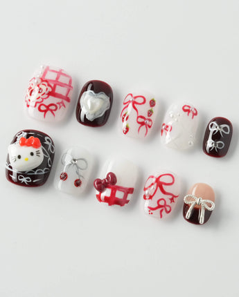 KT Cake press-on nails in extra short squoval with cake-inspired art and soft shine