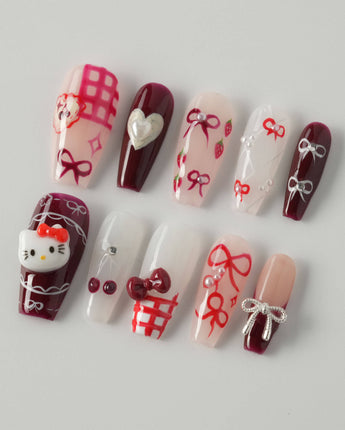 KT Cake press-on nails in medium coffin with glossy dessert-inspired nail art
