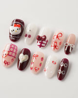 KT Cake press-on nails in medium oval with sweet dessert details and glossy polish