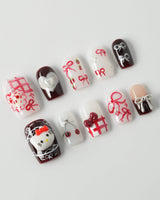 KT Cake press-on nails in short square with playful dessert accents and glossy gel