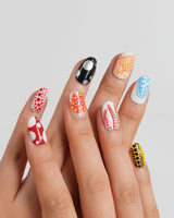 Kusama Dot short oval nail set with red, blue, yellow, black, pink and gold dots